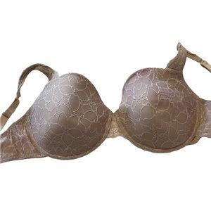 Beige lacy Fredericks of Hollywood bra